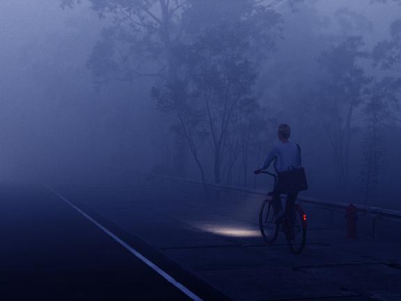 Vrouw fietst op donker fietspad